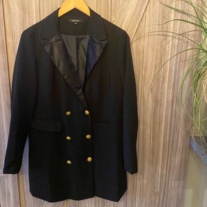 Black jacket with satin lapel and gold buttons.